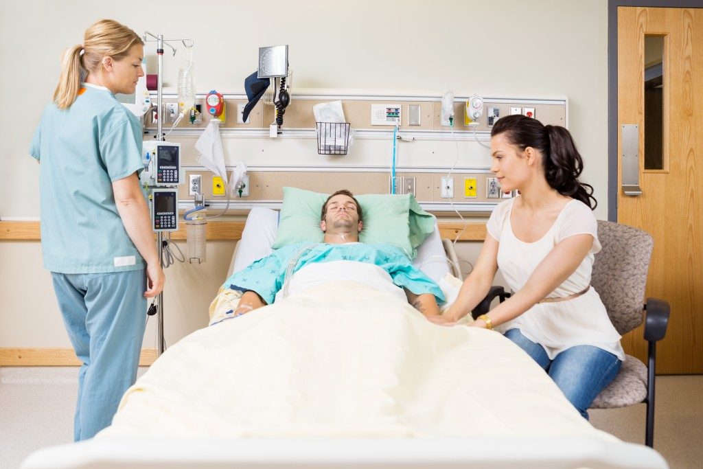 Man lying on a hospital bed