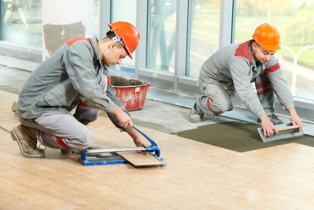 men working on flooring