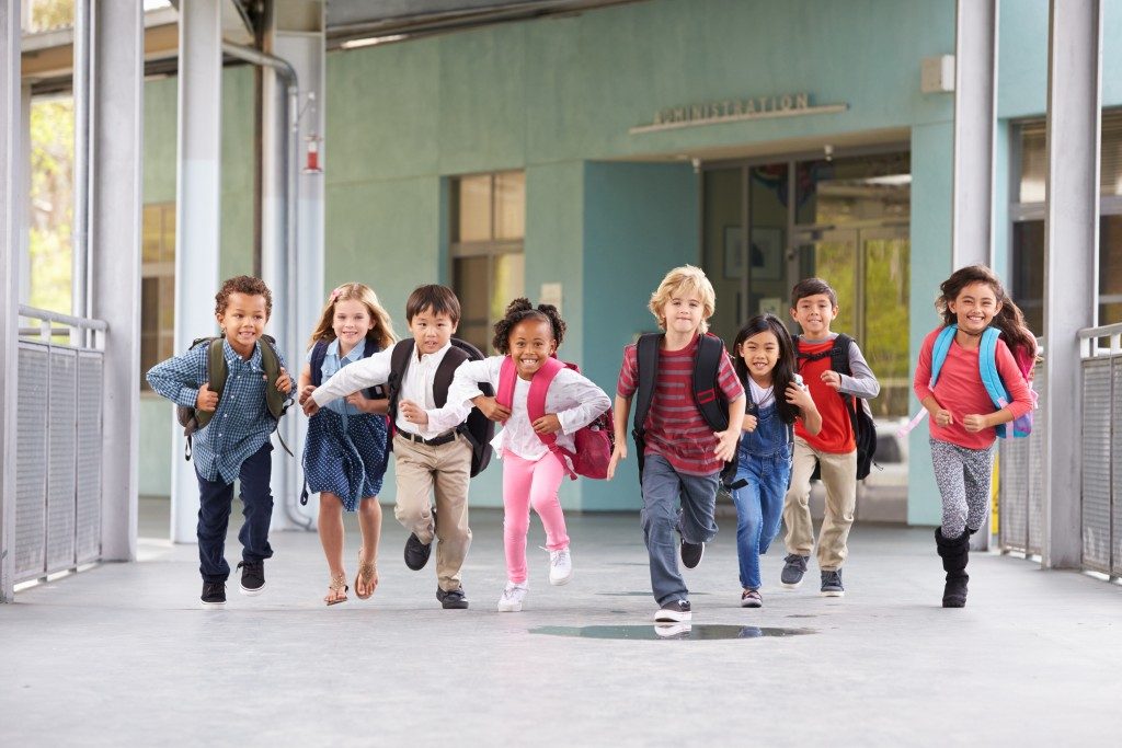 students running in school campus