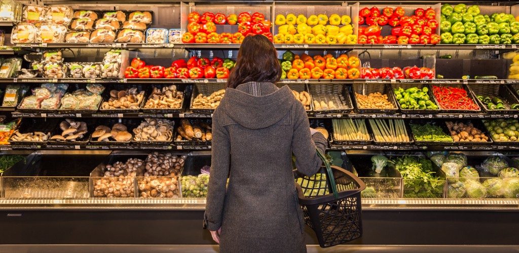 woman buying organic foods in the supermarket