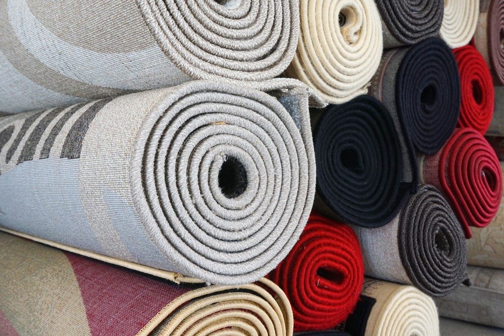rolls of rug in different colors