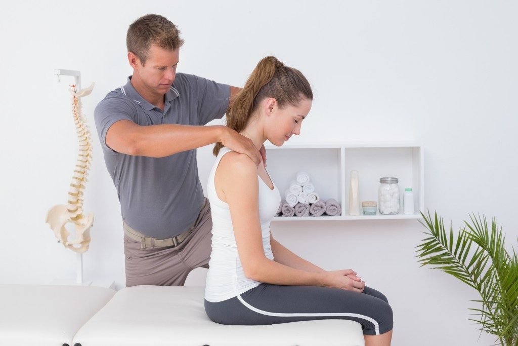 woman getting chiropractic therapy