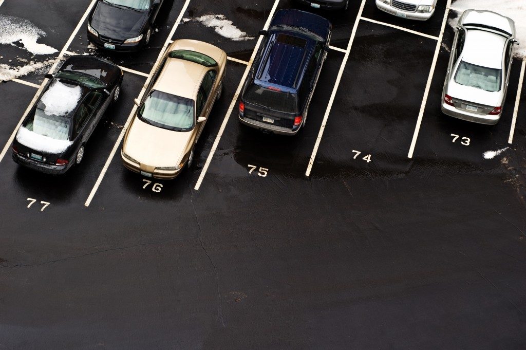 row of cars in a parking space