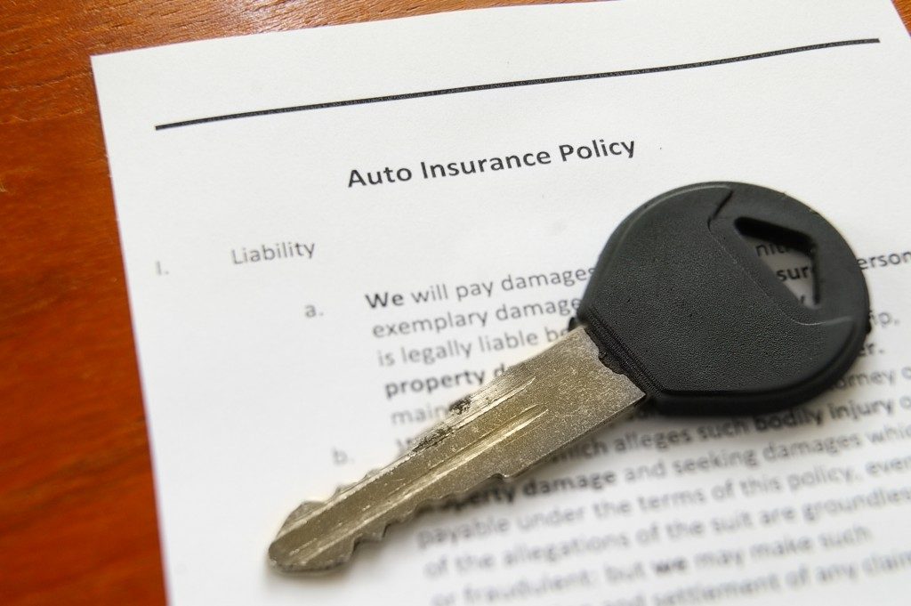 car key and insurance policy