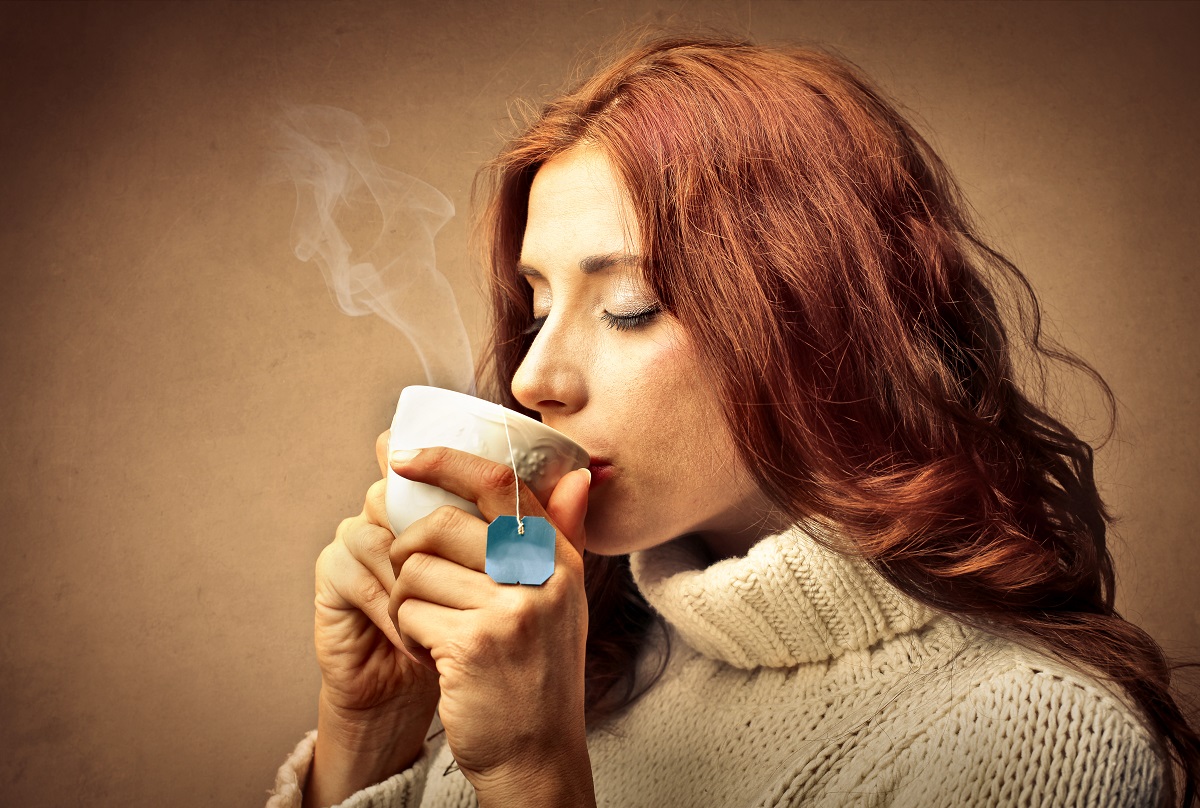 woman drinking hot tea