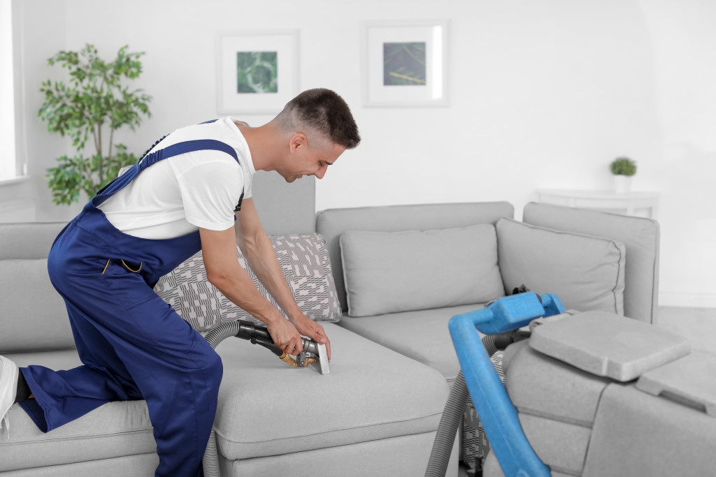 professional house cleaner vacuuming