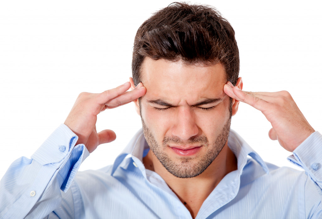 a stressed businessman with a headache