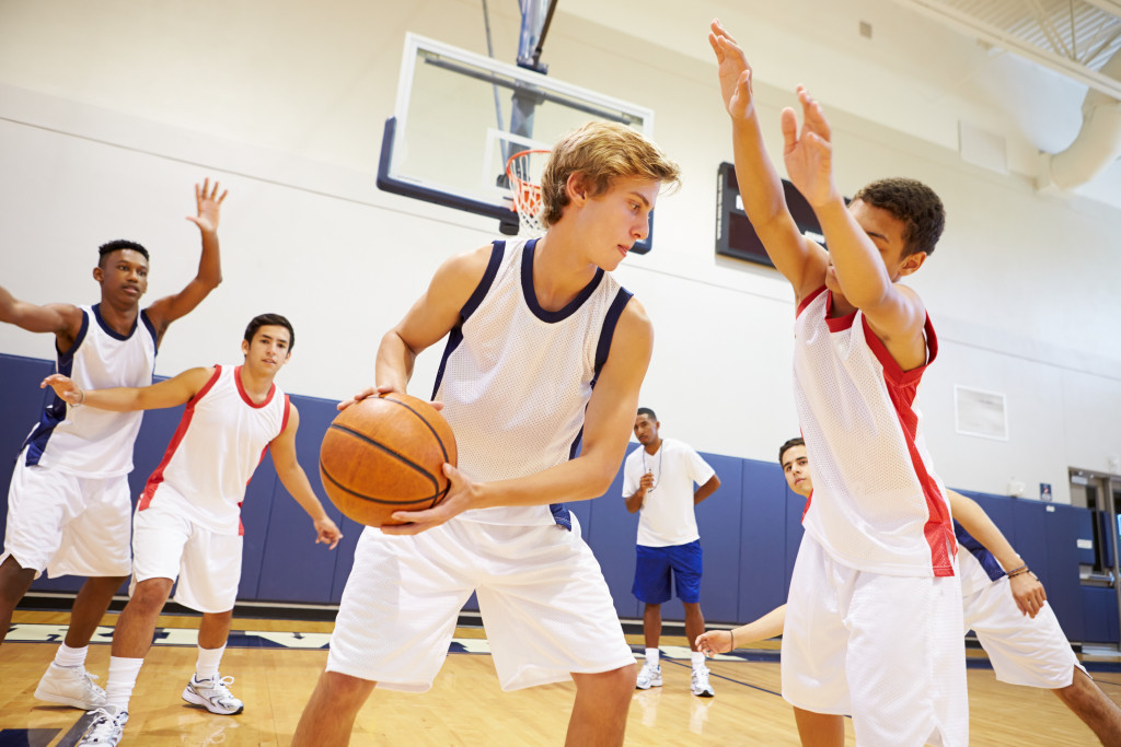 Teen boys playing basketball