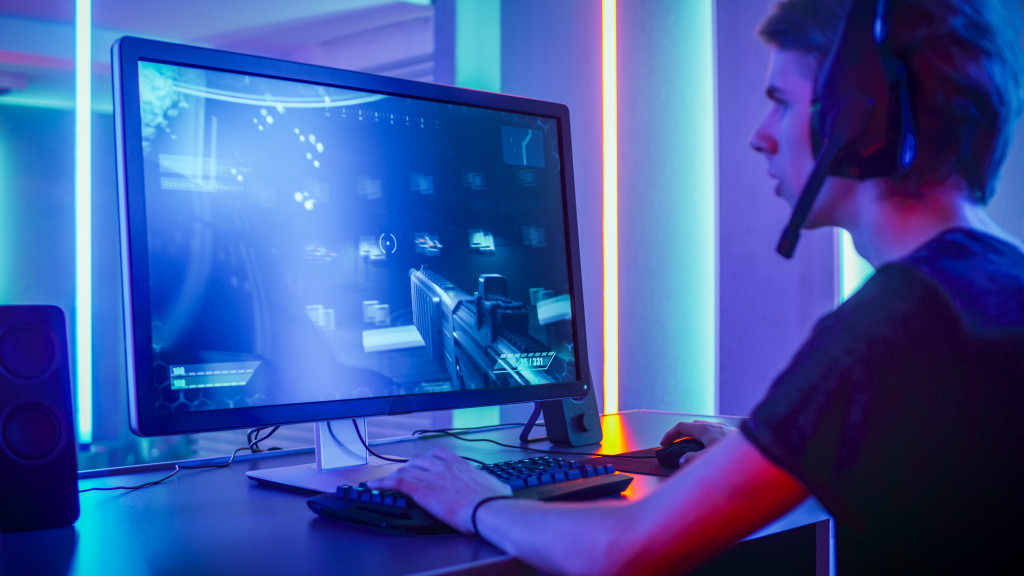 gamer playing fps game in gaming space