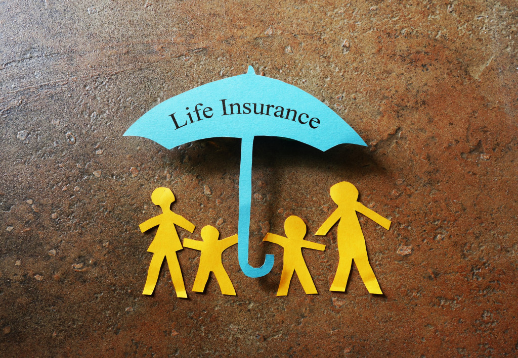 LIFE INSURANCE umbrella with family cutout underneath