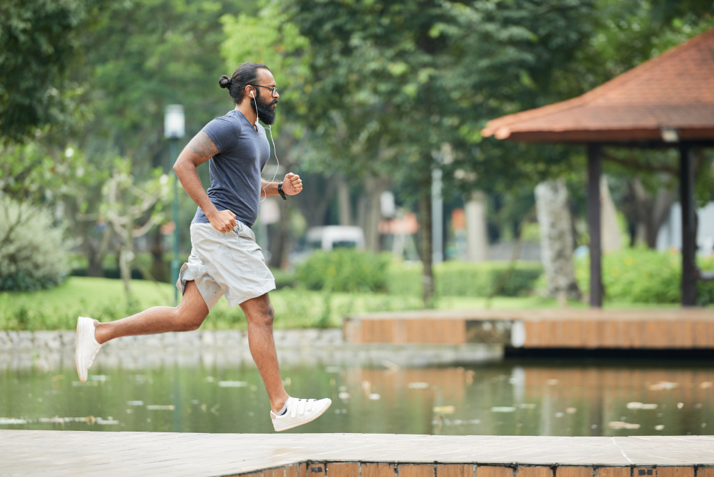 a man taking a jog on a park