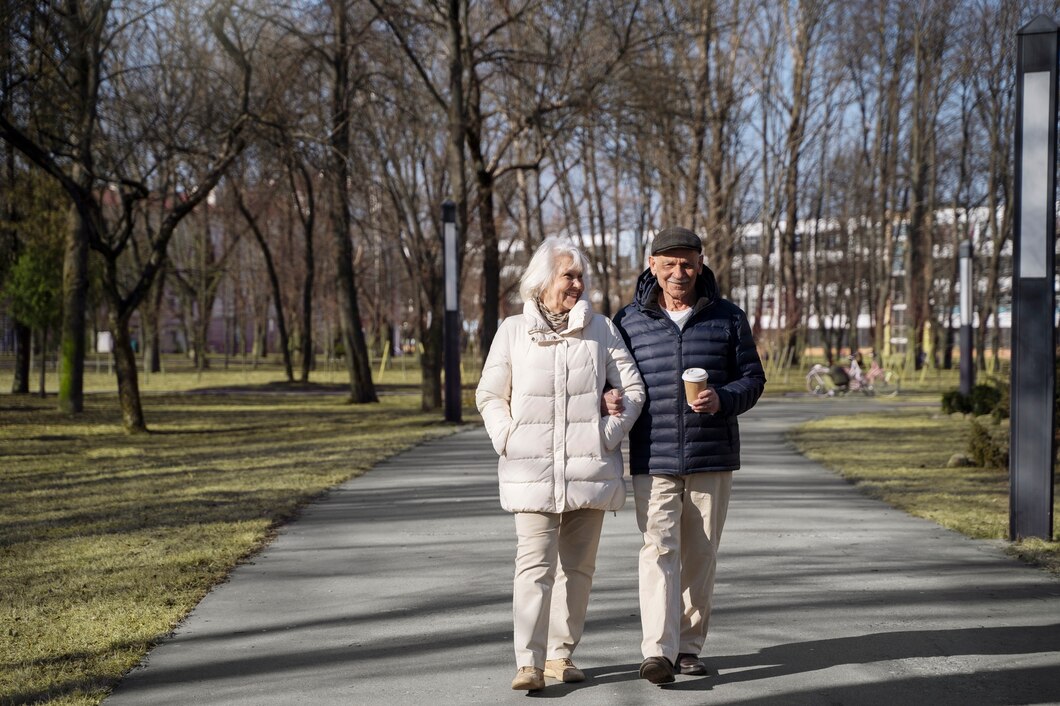 senior couple walking in park